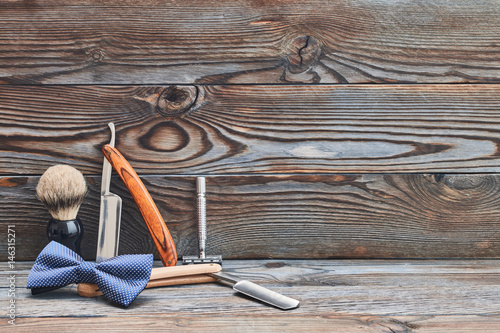 Obraz na plátně Vintage barber shop tools on wooden background
