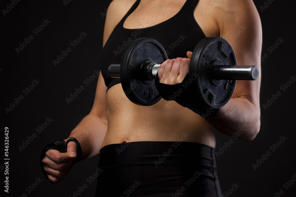 strong woman exercising with a dumbbell strong woman exercising with a dumbbell