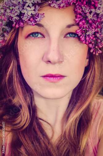 Woman portrait with flower wreath in her head