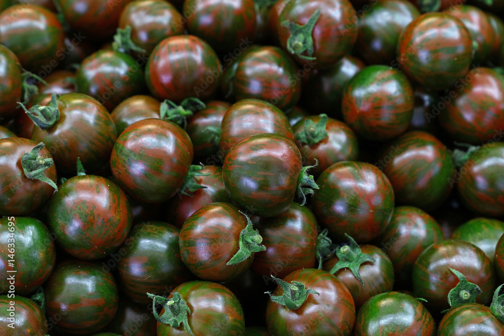 Green Kumato cherry tomatoes background pattern Green Kumato cherry tomatoes background pattern