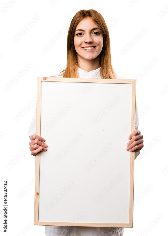 Young doctor woman holding an empty placard
