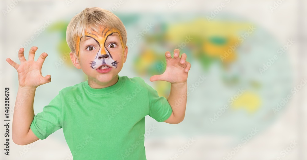 Boy with facepaint growling against blurry map Boy with facepaint growling against blurry map