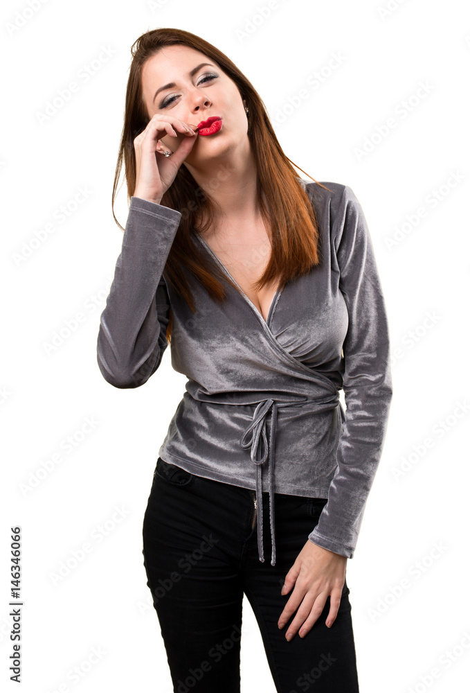 Beautiful young girl making silence gesture Beautiful young girl making silence gesture