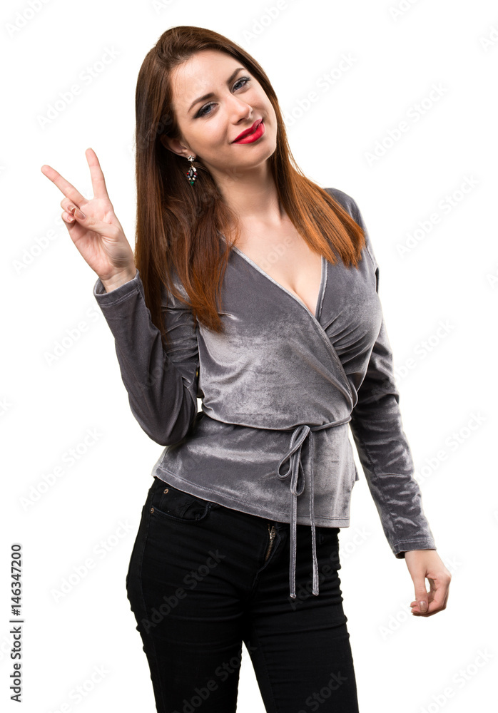 Beautiful young girl making victory gesture Beautiful young girl making victory gesture