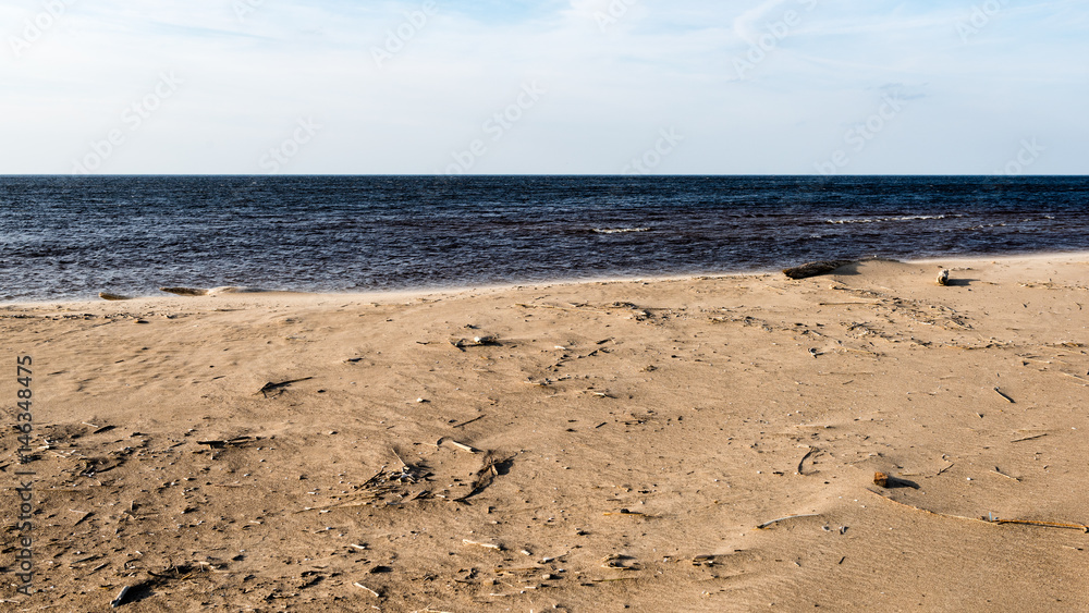 View of a rocky coast beach in the morning. View of a rocky coast beach in the morning.