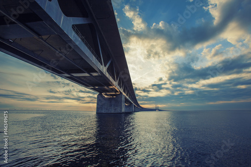 Obraz na plátně The bridge between Copenhagen Denmark and Malmo Sweden, Oresundsbro, sunset in t