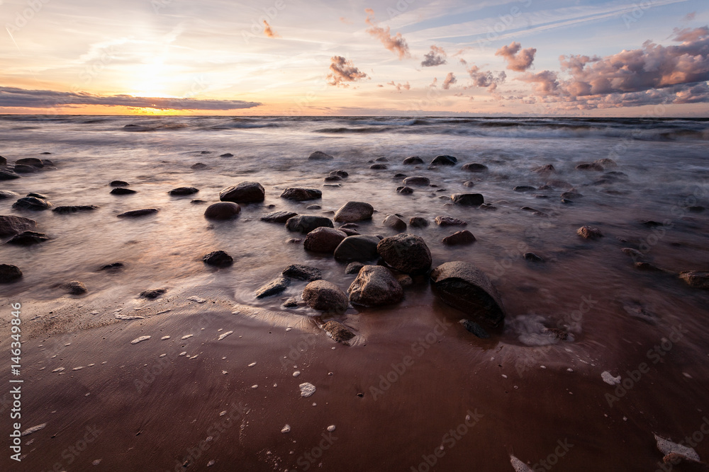 View of a rocky coast beach in the morning. View of a rocky coast beach in the morning.