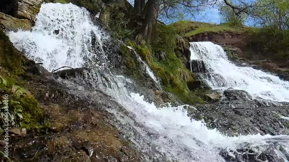 Waterfall in deep mos forest slow motion. Beautiful nature waterfall with rocks and moss.
Waterfall in deep mos forest slow motion. Beautiful nature waterfall with rocks and moss.