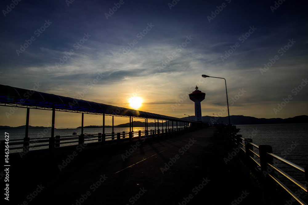 Customs Pier in Ranong Thailand and Lighthouse Images sundown