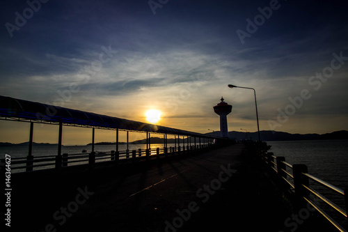 Customs Pier in Ranong Thailand and Lighthouse Images sundown © Jitti