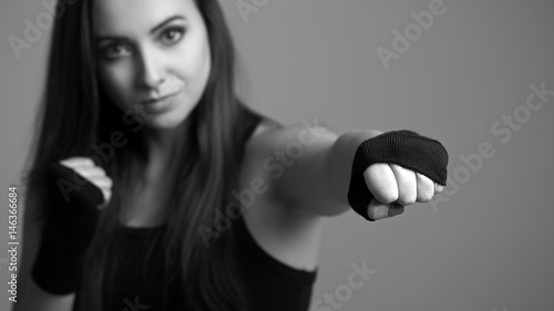 Slika na platnu Young boxing woman. Small depth of field