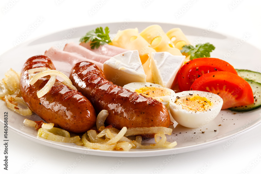 Breakfast with grilled sausages and egg