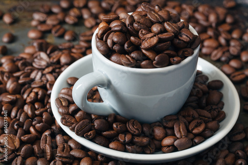 Coffee beans in coffee cup