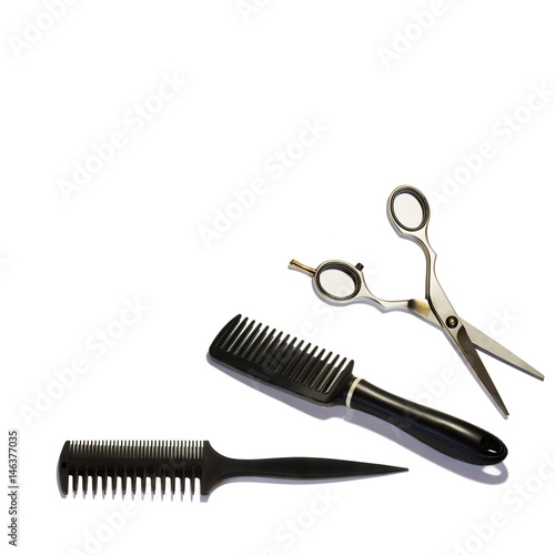 Three different kinds of special scissors and comb for hairdressers and professional grooming