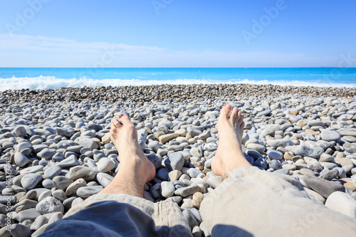Tourist To Nice Lying On The Beach