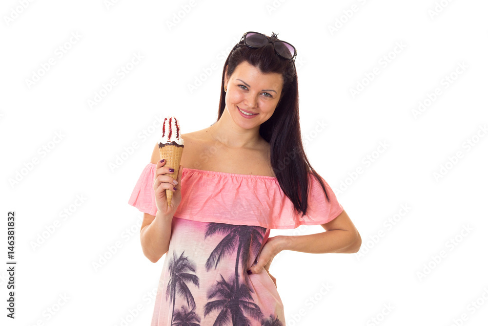 Woman in dress with sunglasses holding ice-cream Woman in dress with sunglasses holding ice-cream