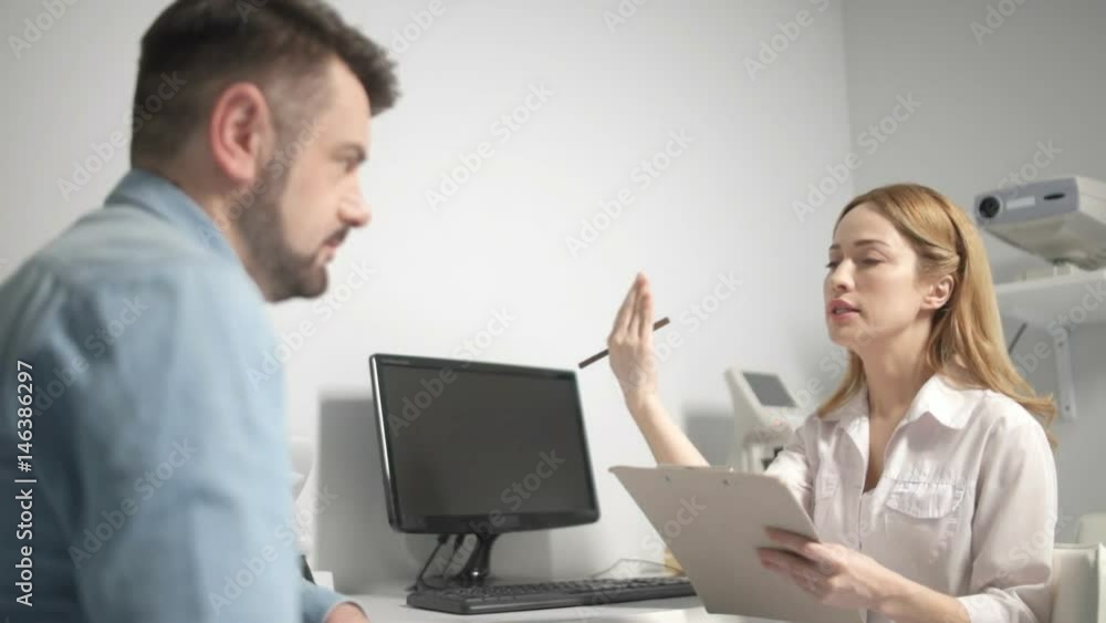 Man consulting optometrist after visual test Man consulting optometrist after visual test