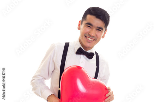 Young man with bow-tie holding balloon © Dmitry Bairachnyi