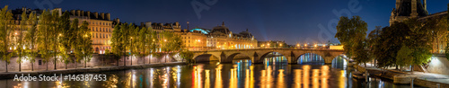 Panoramic view on the Seine River banks, the Pont Royal bridge, and Orsay Museum at dawn. Paris, 7th Arrondissement, France