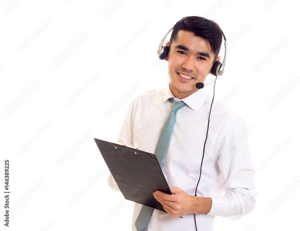 Young man using headphones and holding folder Young man using headphones and holding folder