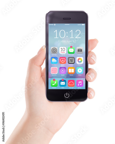 Black mobile smartphone with homescreen colorful application icons on the screen in female hand