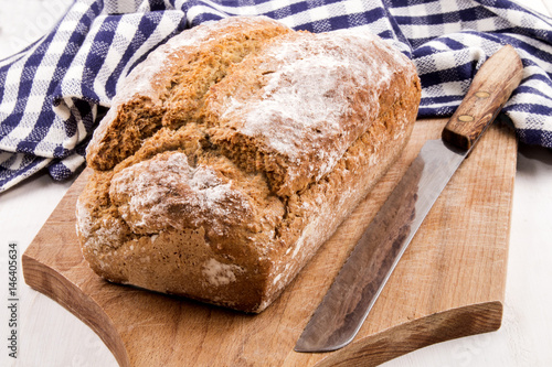 home baked irish soda bread and a bread knife photo