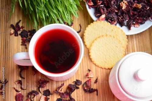 Mug of tea karkade and crackers