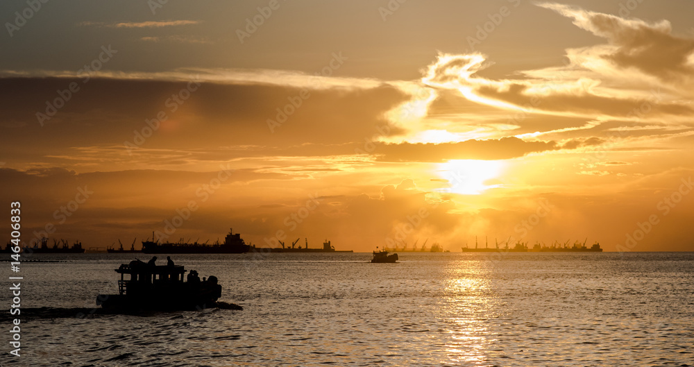 Silhouette of passenger ship at sea with sunset sky background Silhouette of passenger ship at sea with sunset sky background