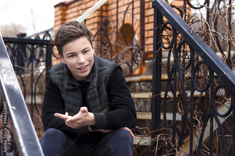 emotional young man sitting on the stairs emotional young man sitting on the stairs