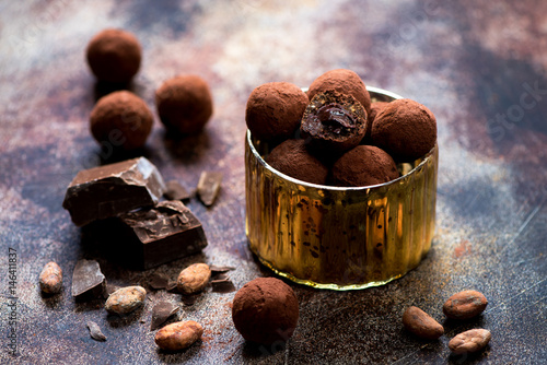 Chocolate candies truffles with chocolate cream close-up photo