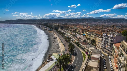 Aerial view of public beach and sea with foamy waves rolling on coast, timelapse photo