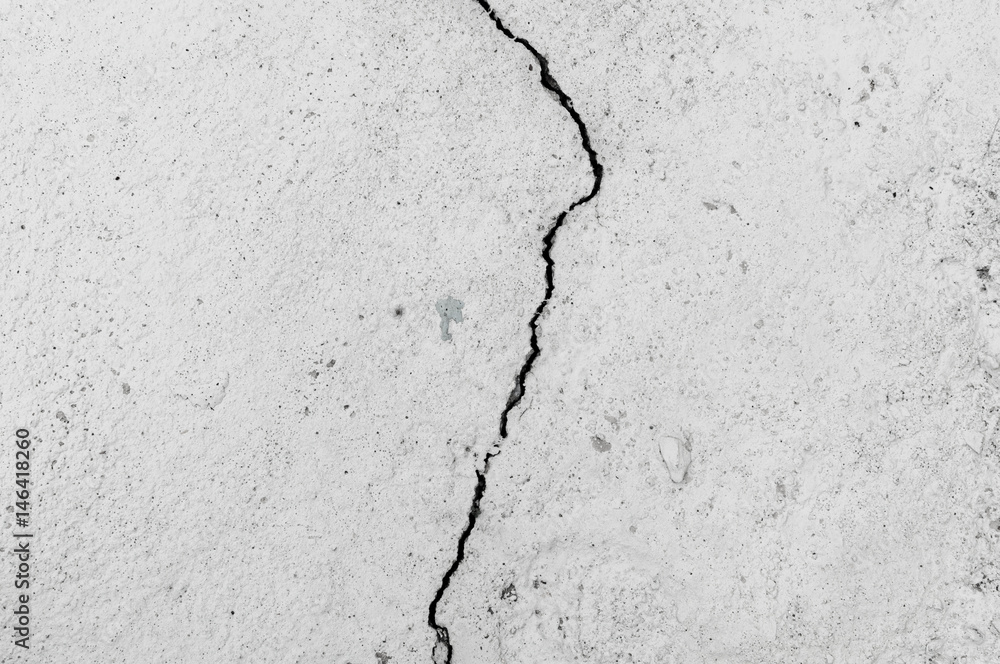 Obraz premium Grungy wall with large crack cement floor texture,cement large crack for background