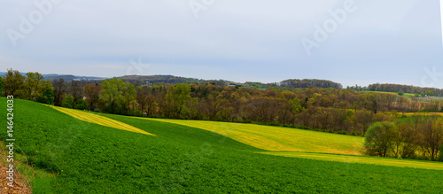 Pennsylvania countryside and farms in spring near Kutztown. Fields just starting to be plowed.