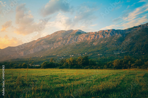 Mountain landscape in Croatia at sunset. Fields and mountains in Croatia