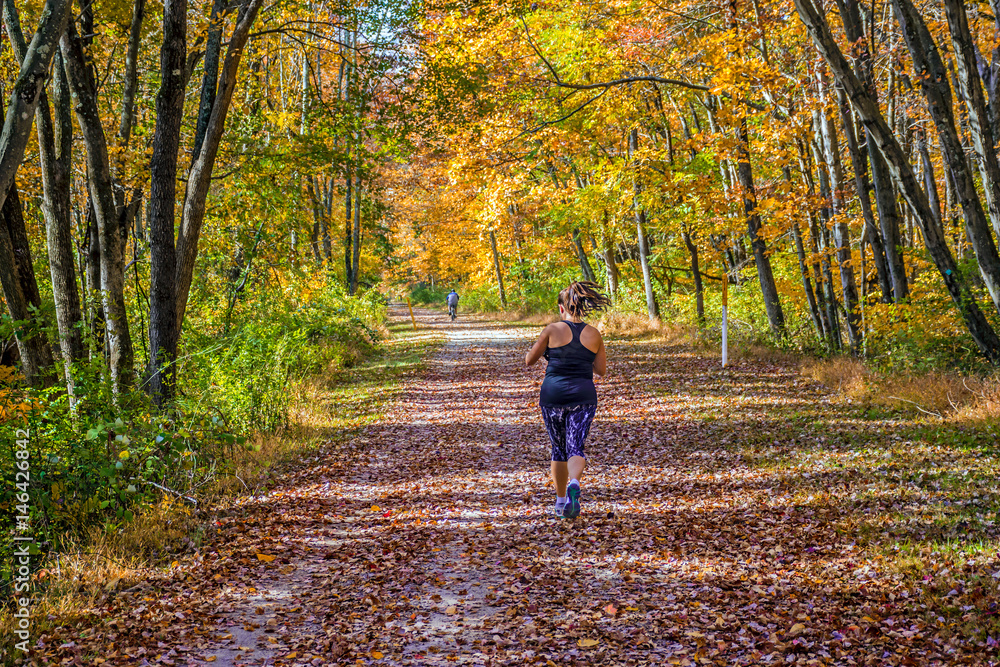 Fototapeta premium Running Through Fall Park