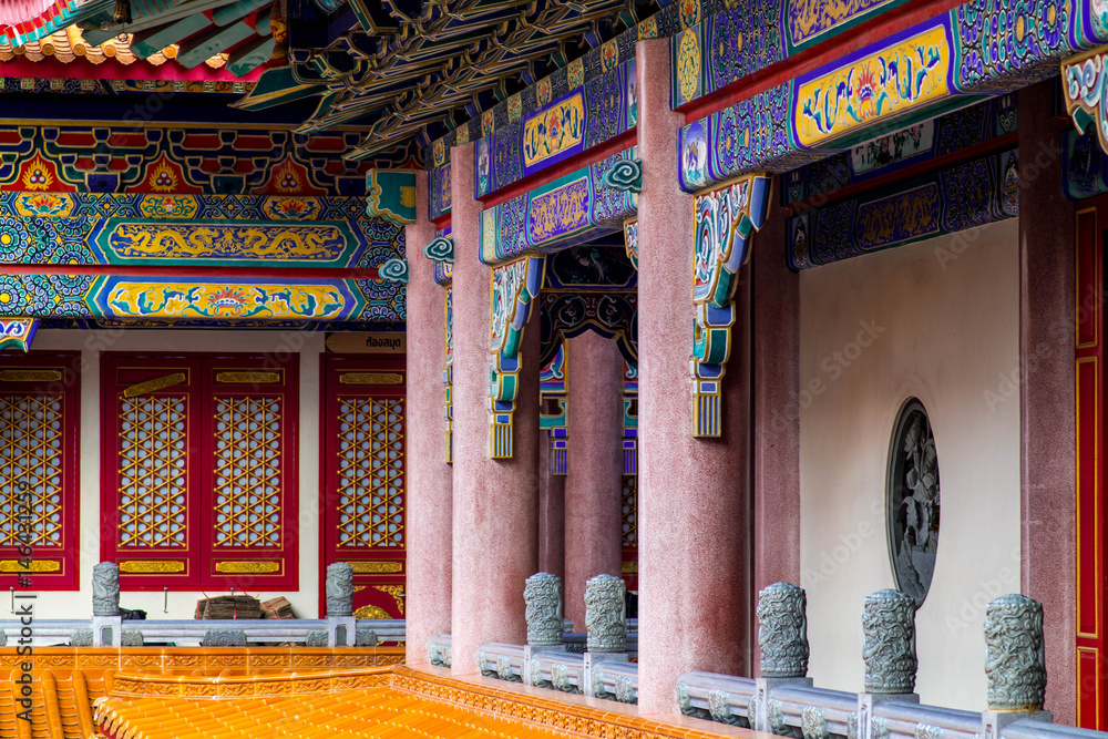 Lion statue and buddha state on chinese temple in Thailand