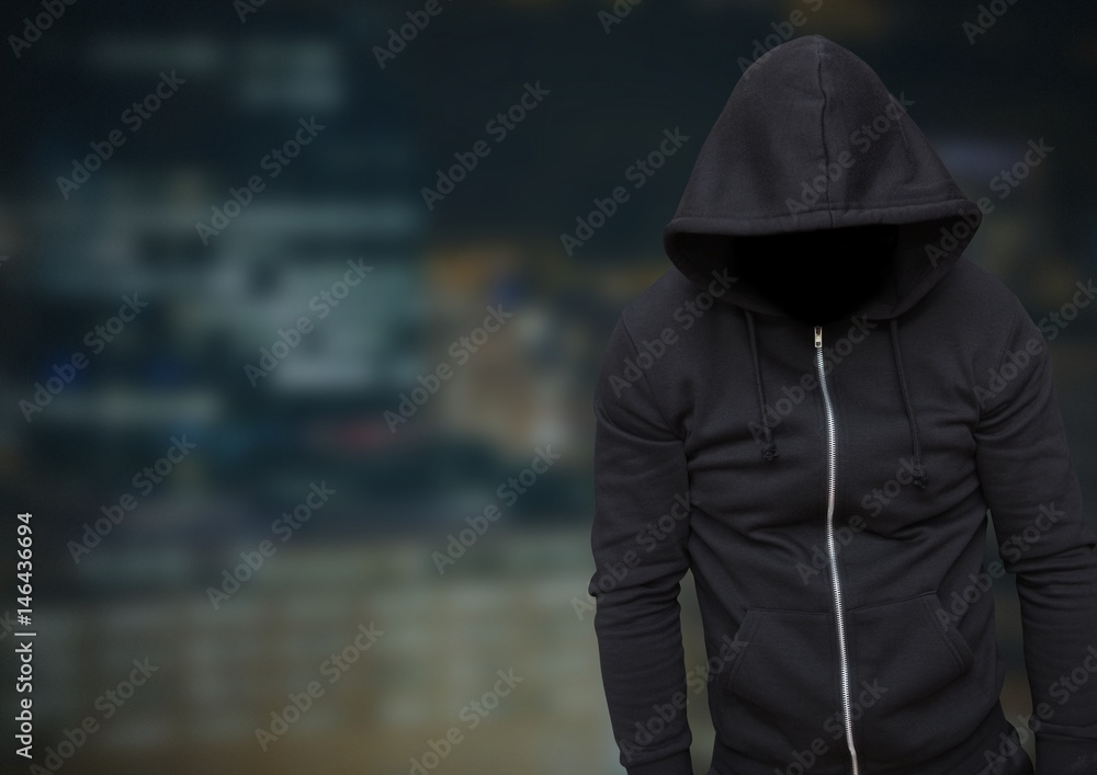 Anonymous Criminal Man in hood in front of night city