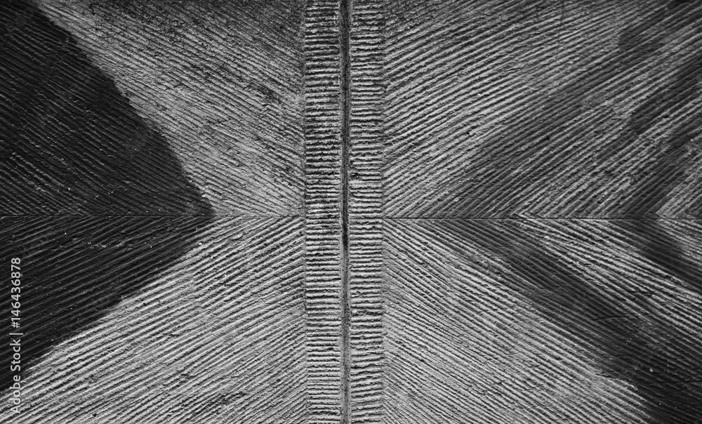 Dirty black and white wall elevation with triangles, abstraction