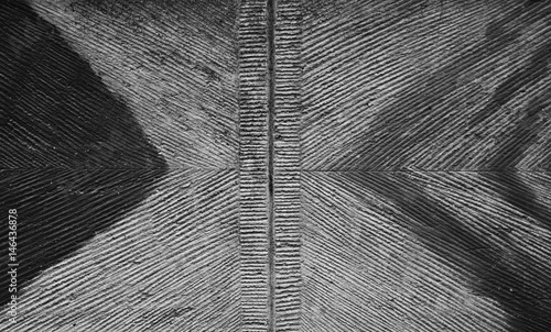 Dirty black and white wall elevation with triangles, abstraction