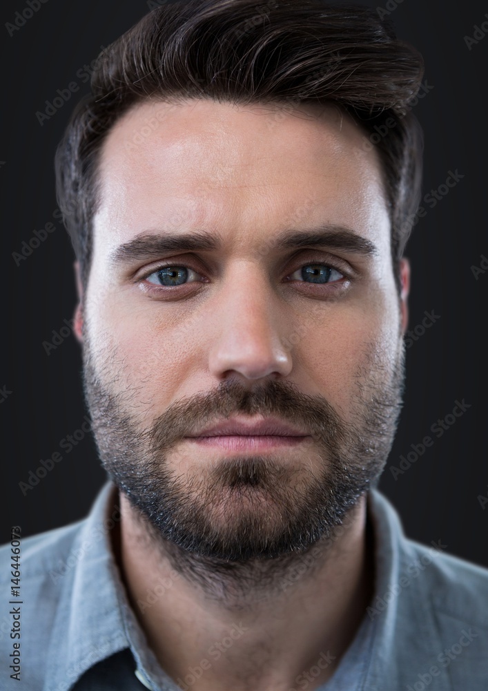 Close up of man's face against dark grey background Close up of man's face against dark grey background