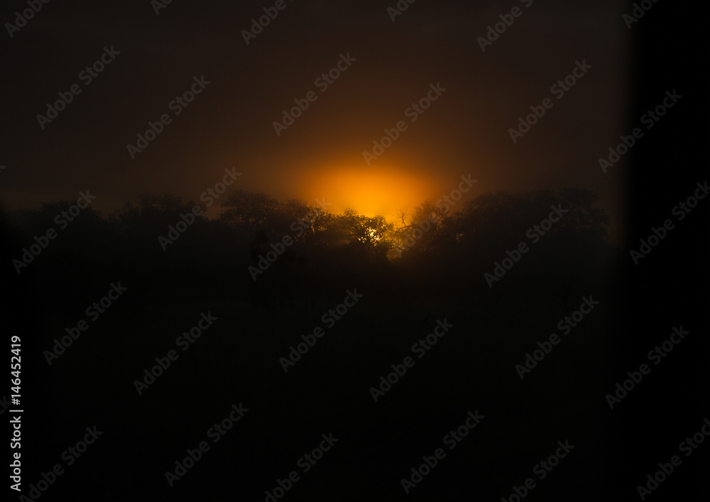 The rising sun over the Hlane-Royal National Park, Swaziland