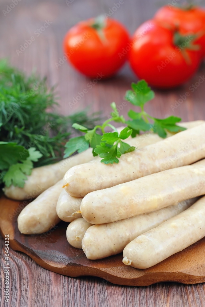 Raw chicken sausages prepared for frying Raw chicken sausages prepared for frying