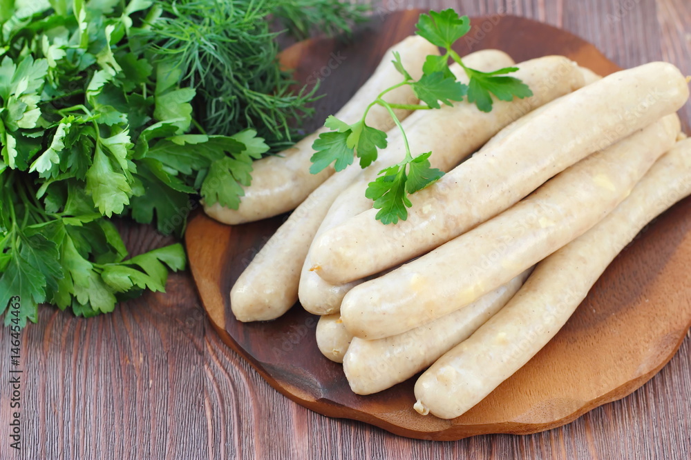 Raw chicken sausages prepared for frying Raw chicken sausages prepared for frying