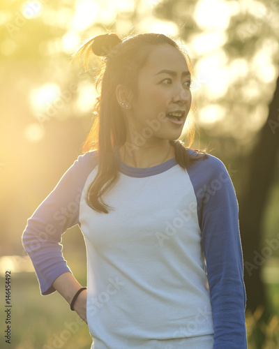 Portrait of beautiful sunset light by beautiful asian girl