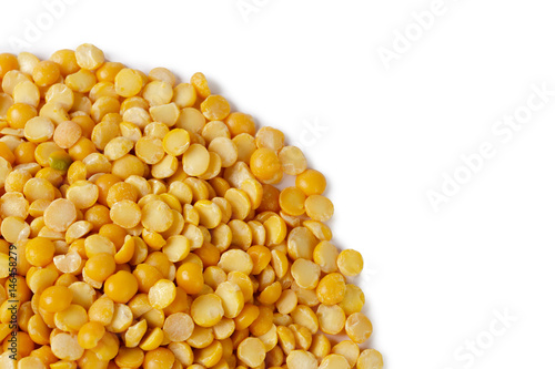 Dry yellow split peas isolated on white.