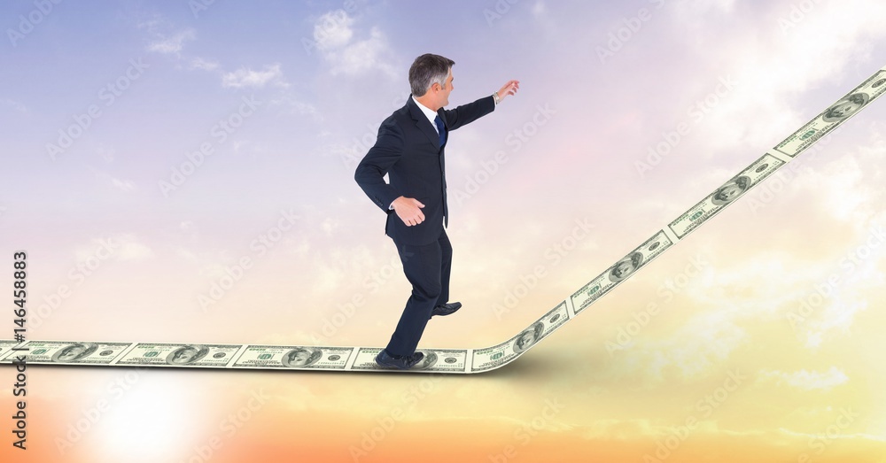 Fototapeta premium Digital composite image of businessman standing on money walkway