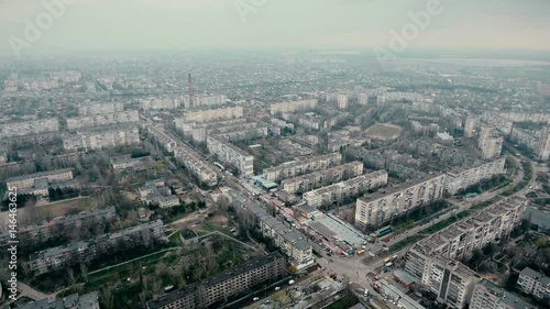 Amazing aerial shot of Kherson city with its  modern cityscape, multistoreyed blocks of apartments, numerous highways, a TV tower and a lot of greenary in Eastern Europe in a sunny day in spring photo