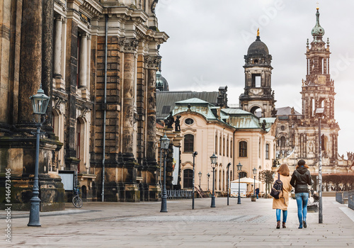Two women walking together in Dresden, Germany. Travel with friends concept