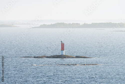 Red beacon on a small rock ...