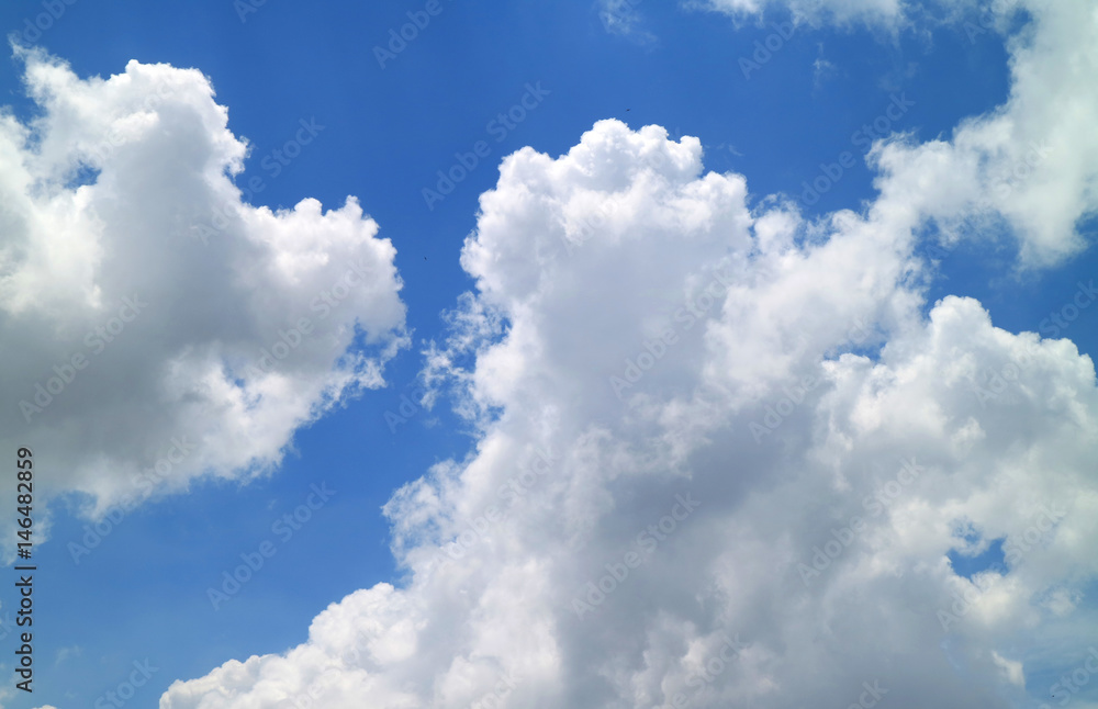 White Fluffy Clouds on Vibrant Blue Sky, a Sunny Afternoon in Bangkok, Thailand White Fluffy Clouds on Vibrant Blue Sky, a Sunny Afternoon in Bangkok, Thailand